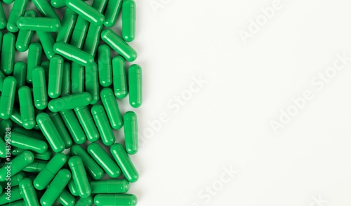 Part of pill pile on white background