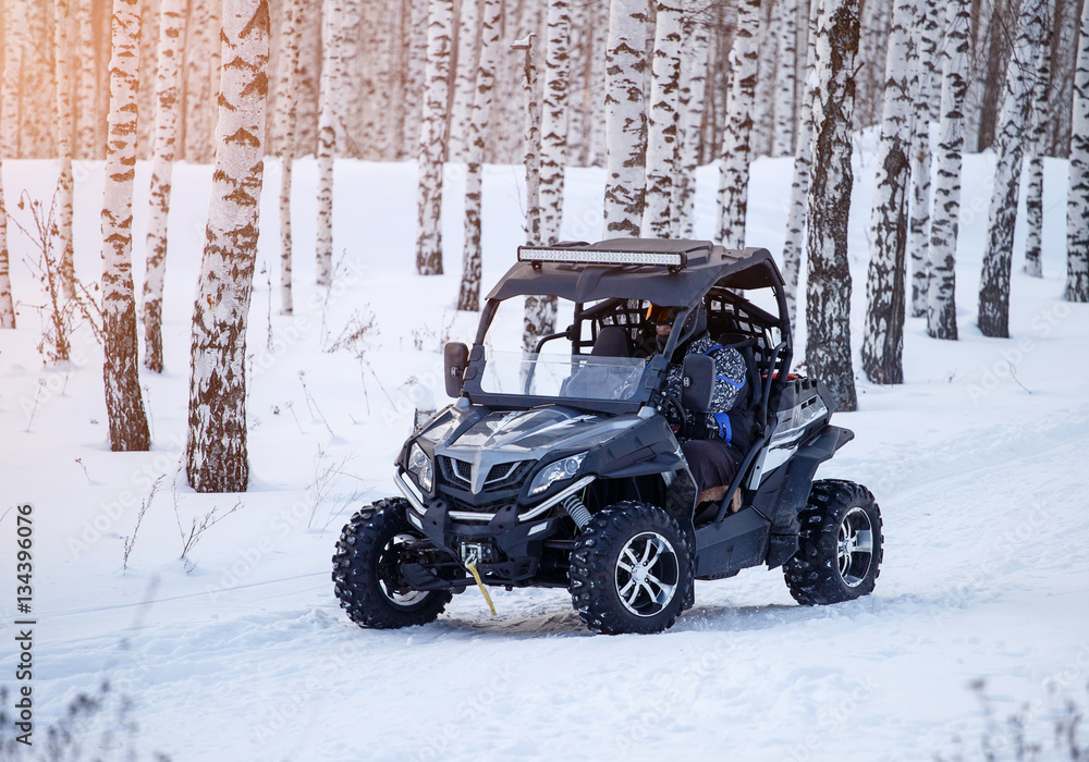 ATV in the winter forest ATV in the winter forest