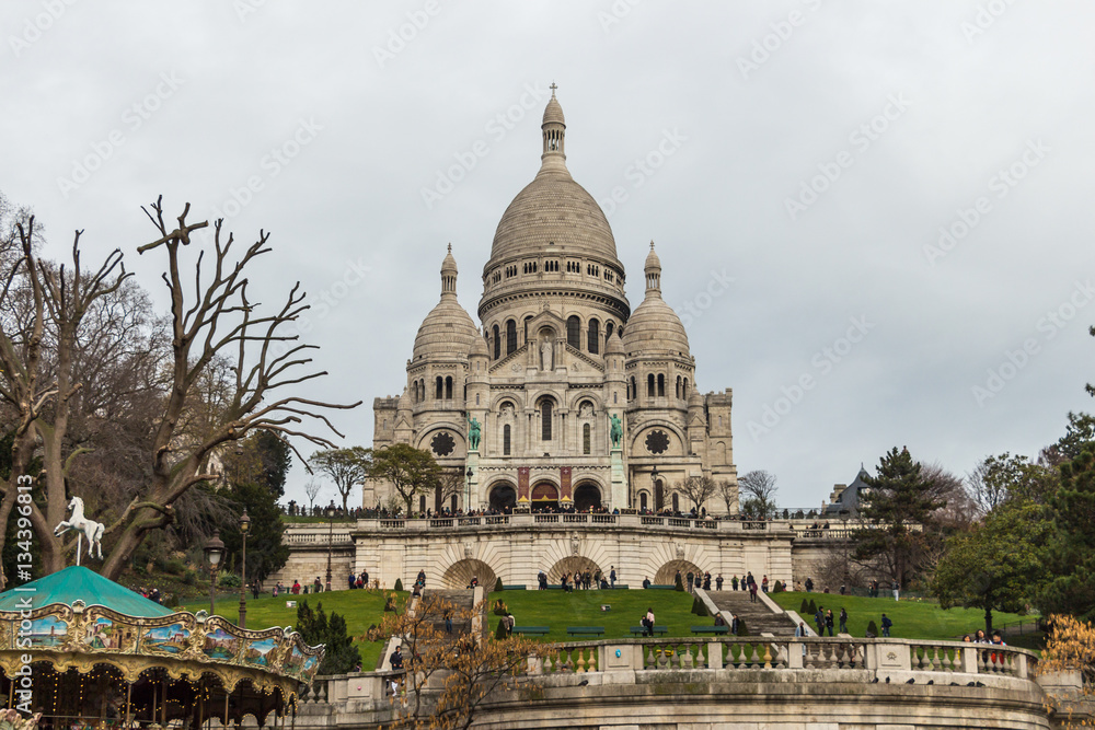 PARIS, FRANCE - DECEMBER 25, 2015:  Sacre Coeur Basilica in winter day. Large medieval cathedral. Basilica of Sacred Heart. 