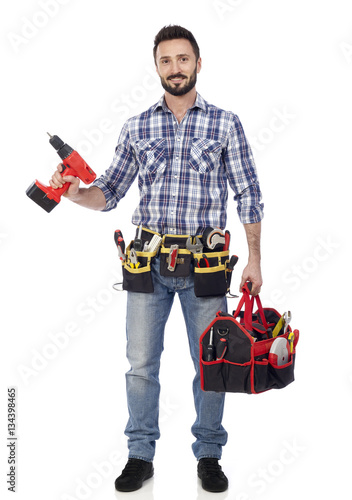 Carpenter with toolbox and drill © goir