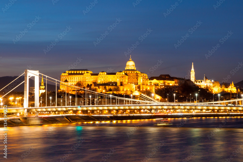 Illuminated Royal Buda Castle above Danube River by night in Budapest, Hungary, Europe. UNESCO World Heritage Site.