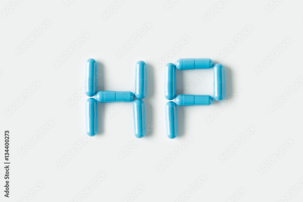 Blue Pills capsules in shape of word HP. Life concept isolated. Blue Pills capsules in shape of word HP. Life concept isolated.