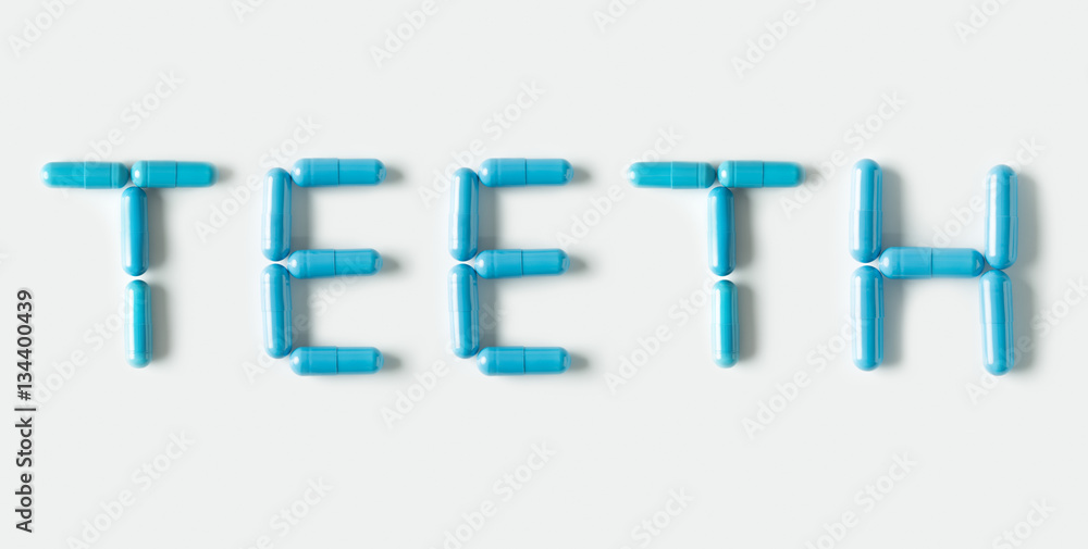 Blue Pills capsules in shape of word Teeth. Life concept isolated. Blue Pills capsules in shape of word Teeth. Life concept isolated.