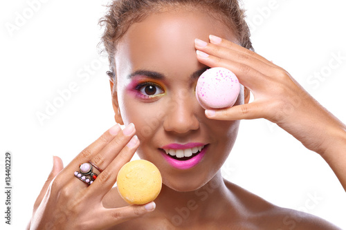 Young woman with tasty maca...