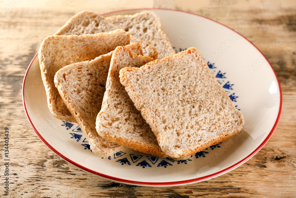 Sliced fresh bread on wooden table closeup