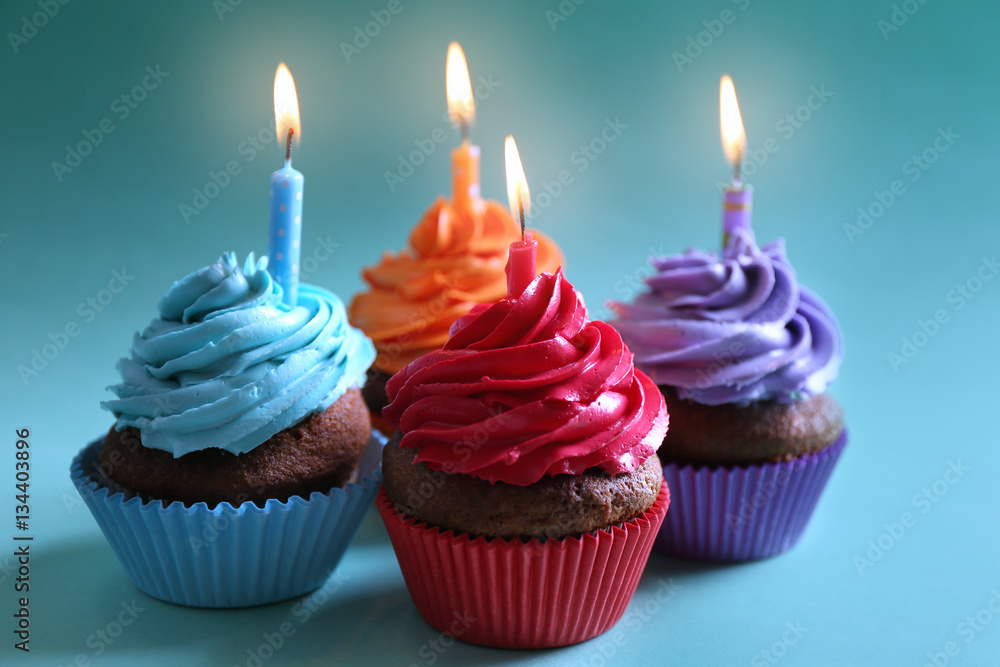 Birthday cupcakes with candles, closeup Birthday cupcakes with candles, closeup