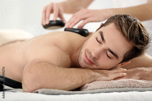 Man having massage in spa salon