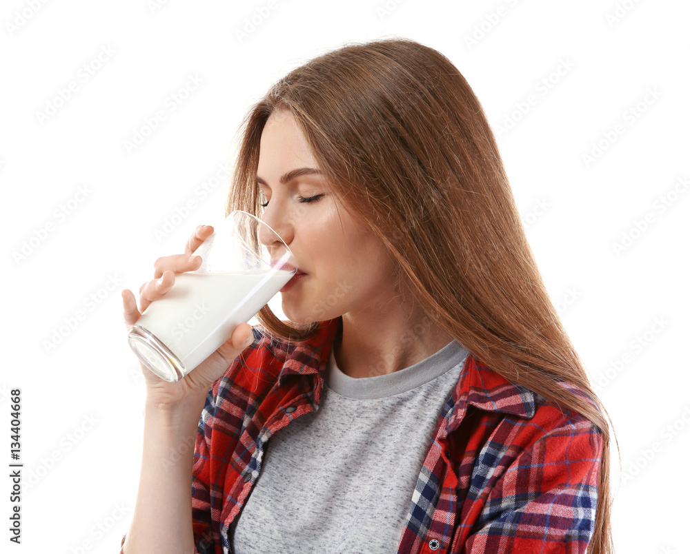 Beautiful young woman drinking milk on white background Beautiful young woman drinking milk on white background