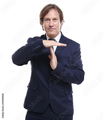 Confident man in suit showi...