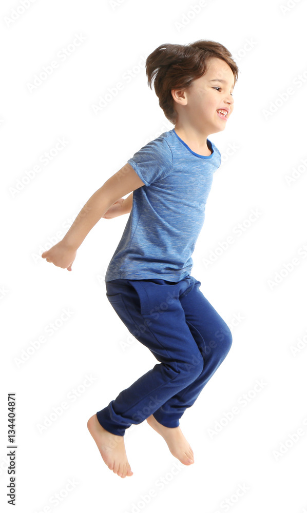 Cute emotional little boy jumping on white background Cute emotional little boy jumping on white background