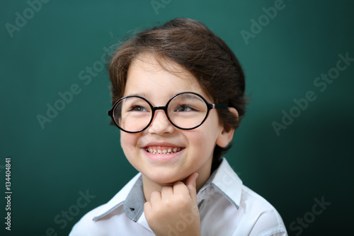 Cute little boy in glasses ...