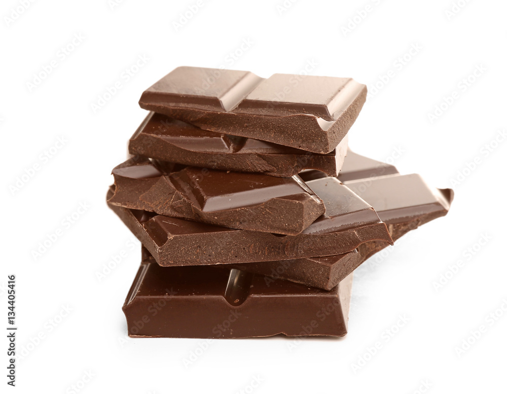 Broken dark chocolate pieces on white background Broken dark chocolate pieces on white background