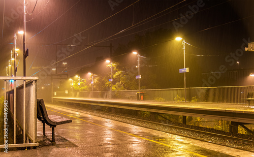 Victoria Park station in the rain at night - Melbourne, Australia photo