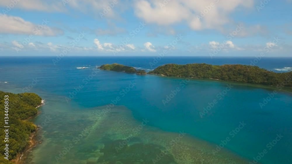 Aerial view: beach, tropical island, bay and lagoon. Tropical landscape sky, clouds and mountains rocks with rainforest. Aerial: Blue lagoon in the ocean. Aerial video.Seascape. 4K video. Travel Aerial view: beach, tropical island, bay and lagoon. Tropical landscape sky, clouds and mountains rocks with rainforest. Aerial: Blue lagoon in the ocean. Aerial video.Seascape. 4K video. Travel