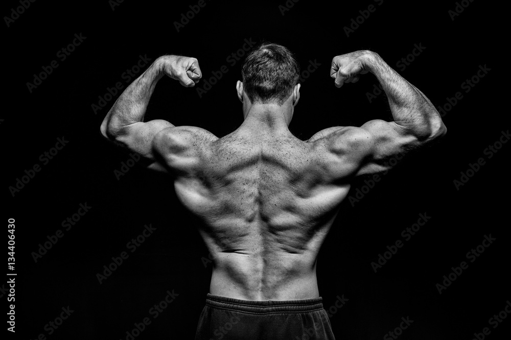 Fototapeta premium handsome bodybuilder man with muscular body training and posing