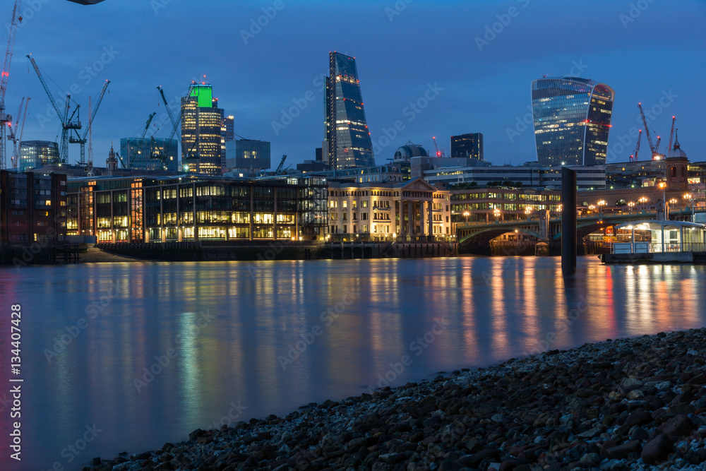 LONDON, ENGLAND - JUNE 18 2016: Night Photo of Thames River and skyscrapers,  London, Great Britain