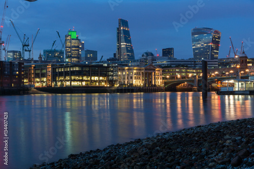 LONDON  ENGLAND - JUNE 18 2016  Night Photo of Thames River and skyscrapers   London  Great Britain