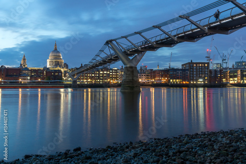 LONDON  ENGLAND - JUNE 18 2016  Night photo of Millennium Bridge  Thames River and  St. Paul Cathedral  London  Great Britain