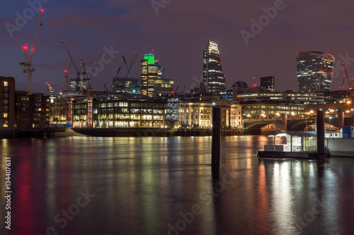LONDON  ENGLAND - JUNE 18 2016  Night photo of Millennium Bridge  Thames River and  St. Paul Cathedral  London  Great Britain