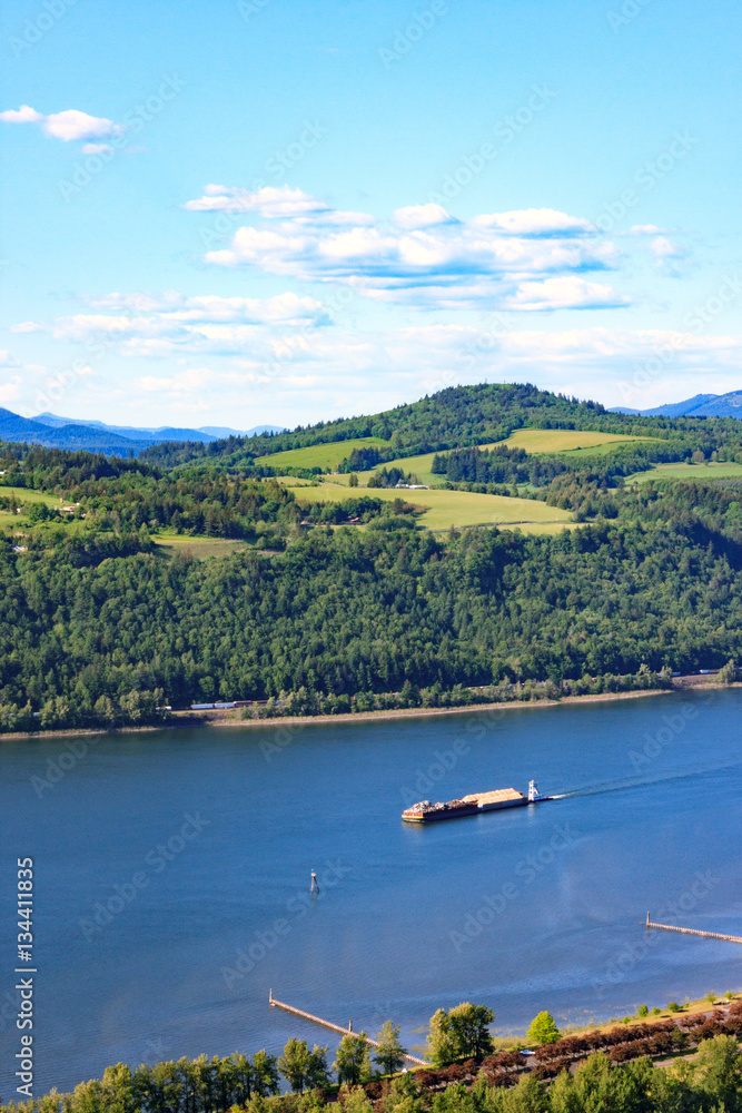 A barge floats down the Columbia River near Portland, Oregon.
