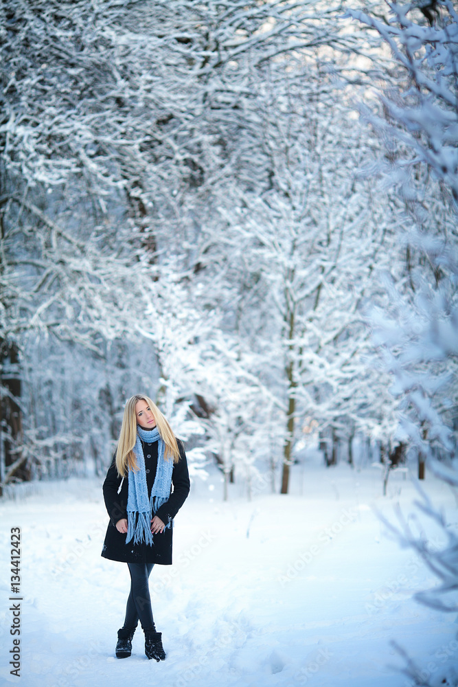 Premium Photo  Pretty young woman in winter outfit walking during snowfall