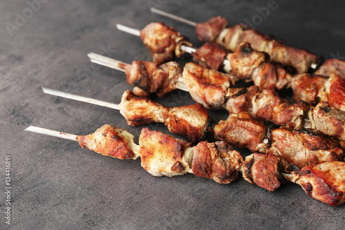 Fresh tasty barbecue on grey background