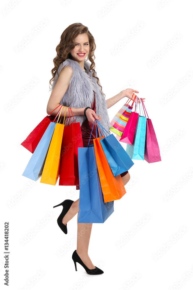 Woman with shopping bags on white background