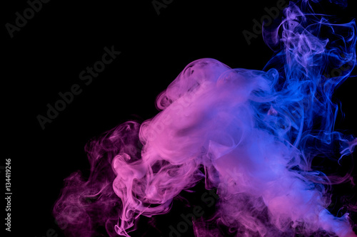 Abstract smoke Weipa. Personal vaporizers fragrant steam. The concept of alternative non-nicotine smoking. Blue lilac smoke on a black background. E-cigarette. Evaporator. Taking Close-up. Vaping. photo