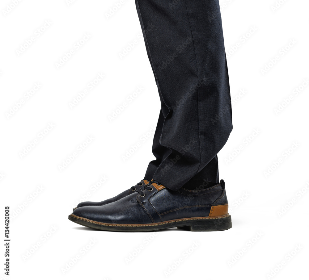 Two man's feet in fashionable shoes and black trousers isolated on the white background