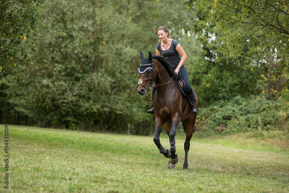 Young Woman Riding Her Horse