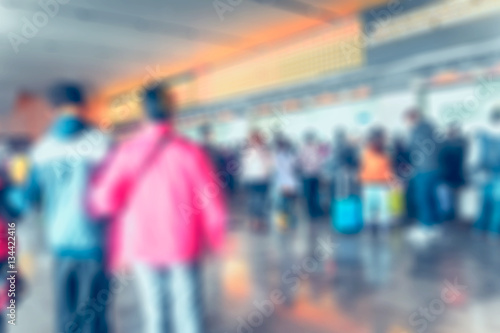 Blurred background : people queuing to buy a public transport au