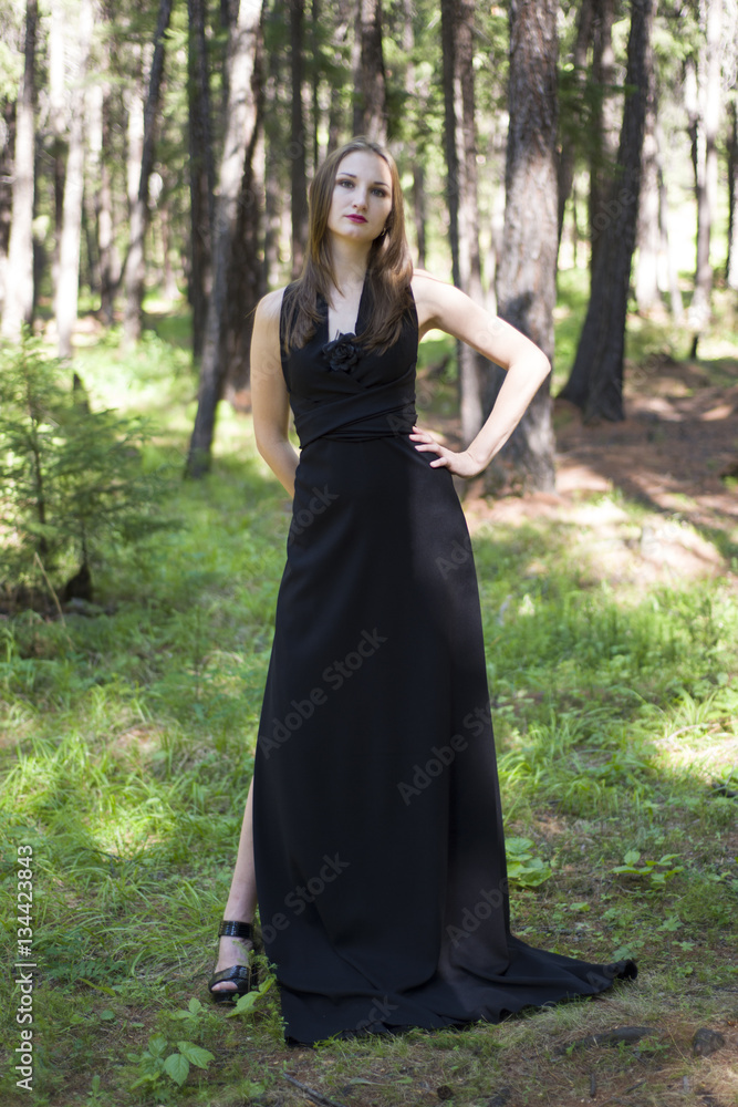 Beautiful young girl walking in a fairy forest. Beautiful young girl walking in a fairy forest.