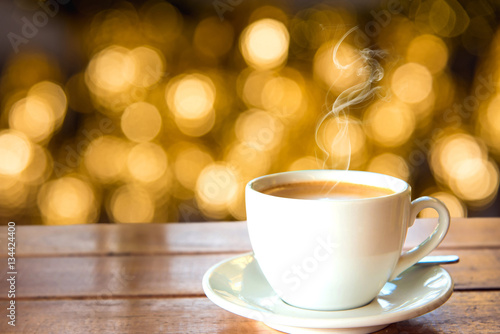 Cup of coffee on wooden table