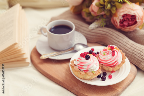 breakfast with coffe and tasty cakes in bed
