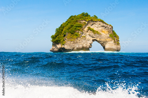 Wild arc rock near Manta Point diving place, Bali, Indonesia