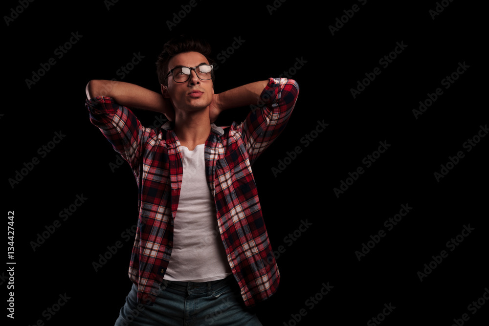 relaxed young sexy man wearing glasses looks up relaxed young sexy man wearing glasses looks up