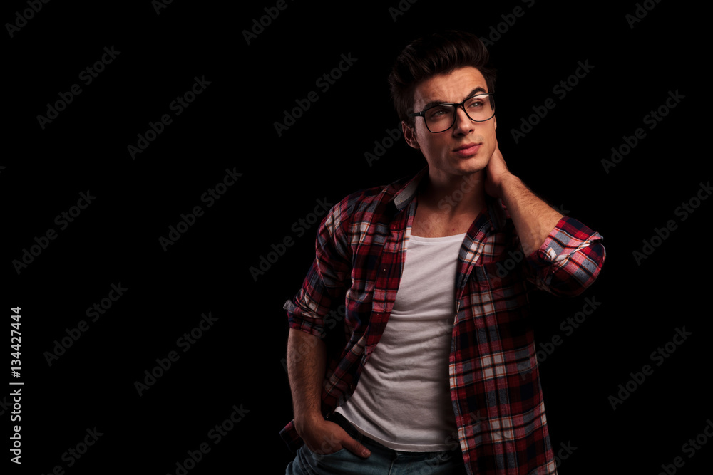 handsome casual man looking to side and thinking