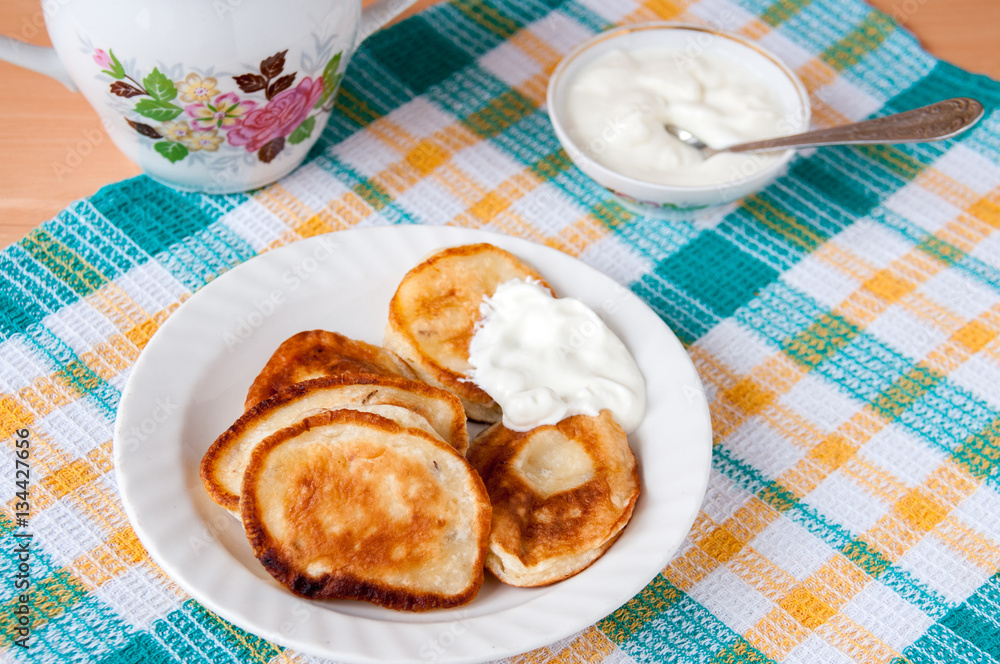 Delicious pancakes with sour cream for breakfast Delicious pancakes with sour cream for breakfast
