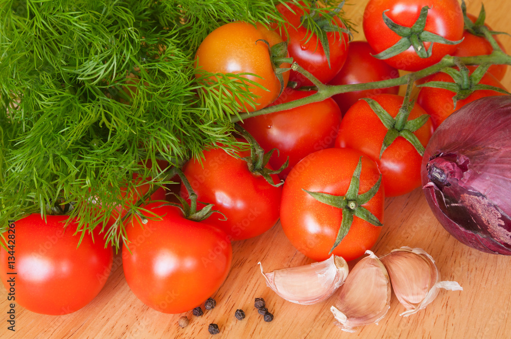 tomatoes garlic onions and herbs on the table tomatoes garlic onions and herbs on the table