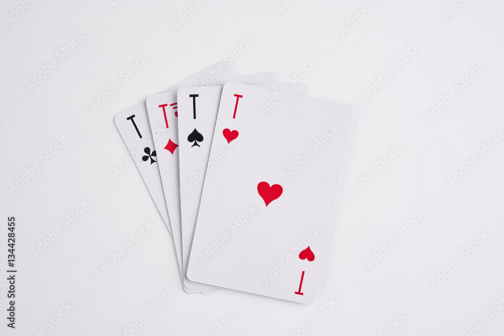 A winning poker hand of four aces playing cards suits on white A winning poker hand of four aces playing cards suits on white