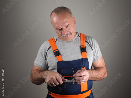 The engineer in construction pants holding steelconsult photo