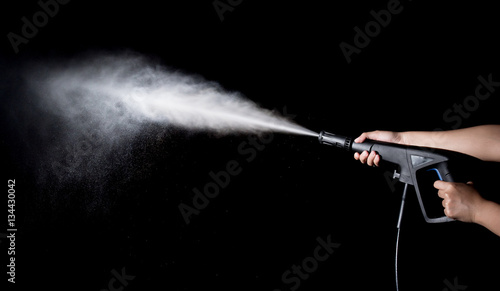 Fotografi Water splashes with high pressure water jet on black background