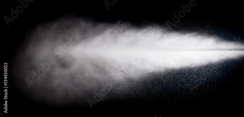 water spray of high pressure water jet on black background photo
