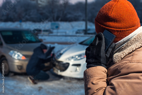 Two upset men on winter city street
