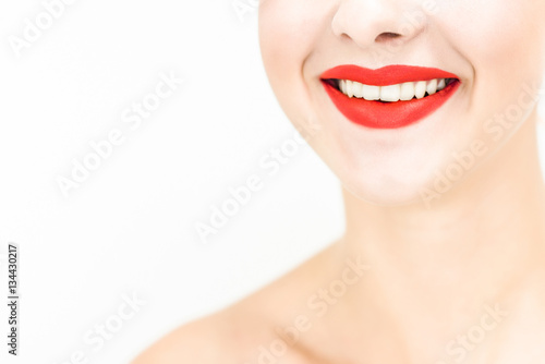 Close-up smile. Red lipstick. Space for text