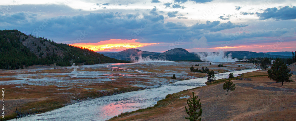 Firehole River at sunset flowing past the Midway Geyser Basin in Yellowstone National Park in Wyoming USA