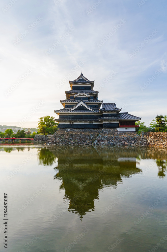 Matsumoto castle reflect on water in evening at nagano japan Matsumoto castle reflect on water in evening at nagano japan