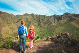 little boy and girl travel in mountains