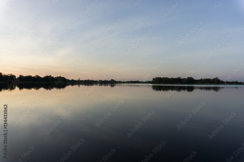 Fototapeta premium Beautiful sunrise on the lake and blue sky