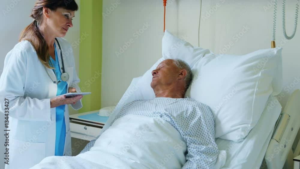 Female doctor interacting with patient at hospital Female doctor interacting with patient at hospital